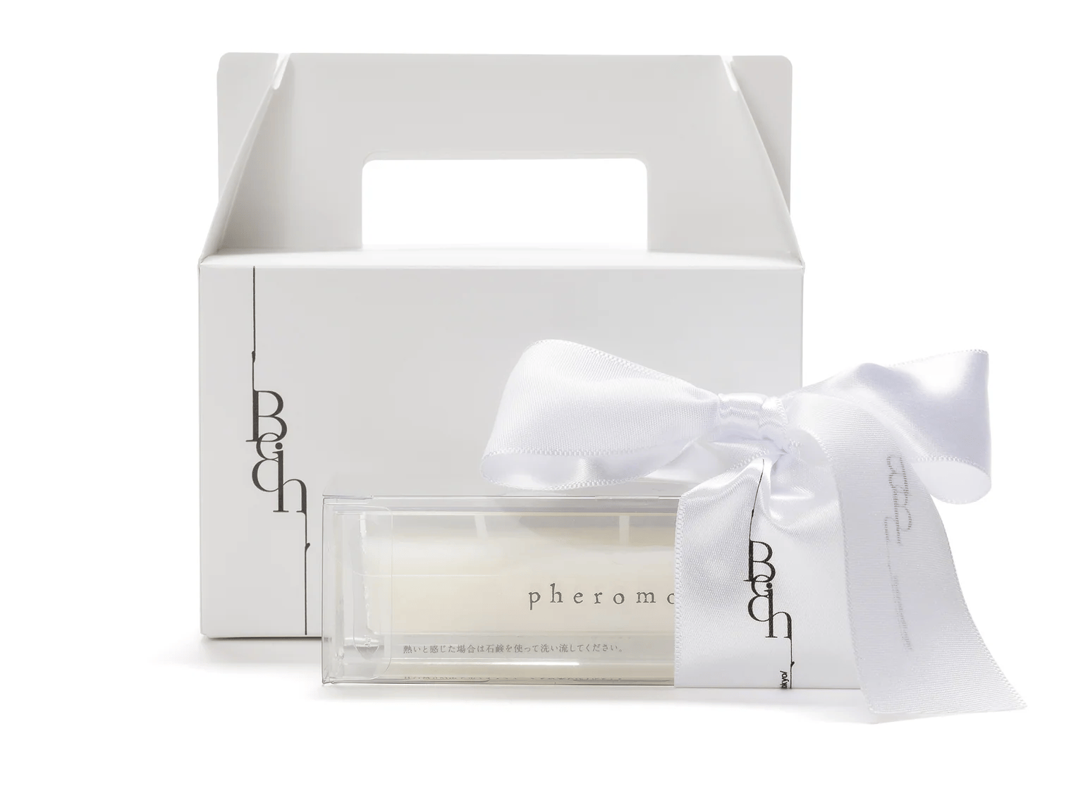 リボン付きの美容液キャンドル