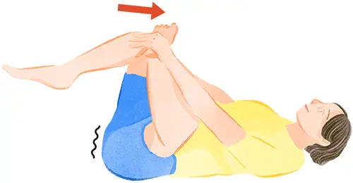 ②両手で右ひざをかかえそのままおなかに近づける